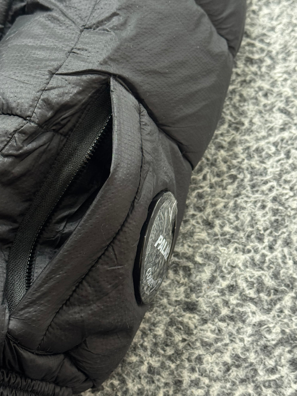 CP COMPANY x PALACE PUFFER BLACK JACKET