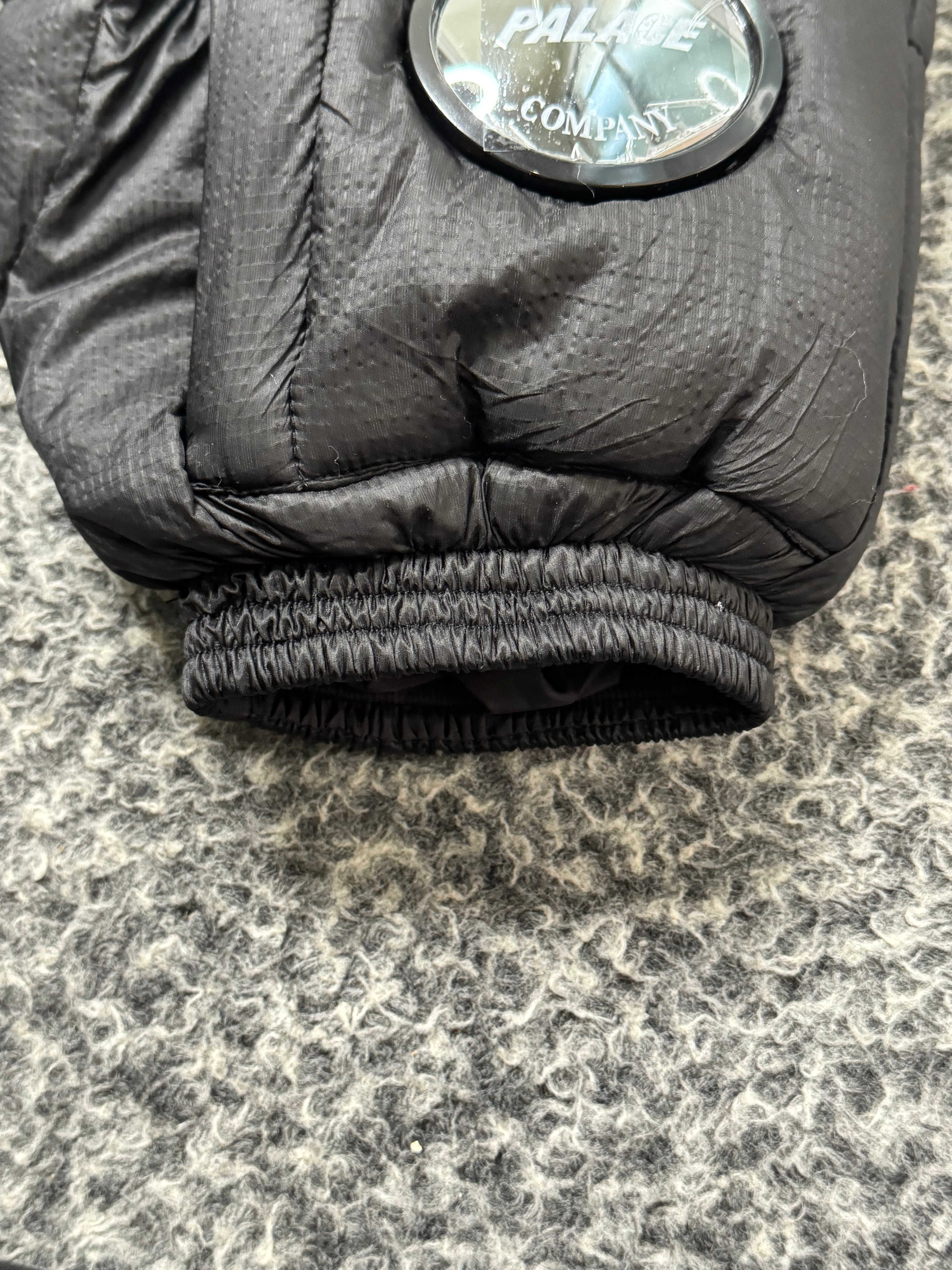 CP COMPANY x PALACE PUFFER BLACK JACKET